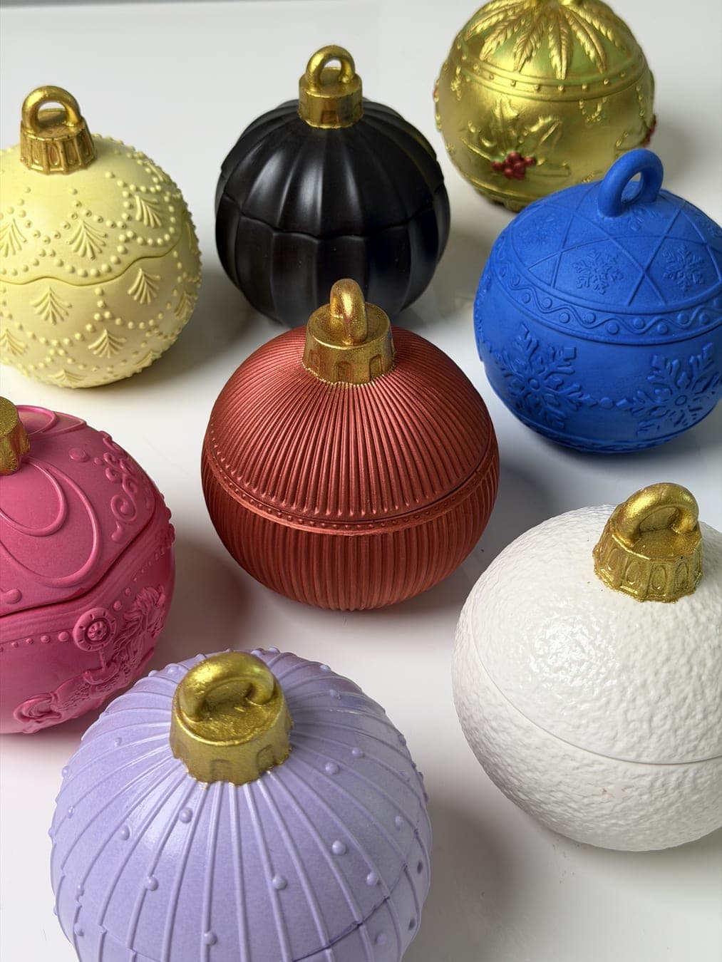 Eco-stone Christmas bauble containers in festive colours