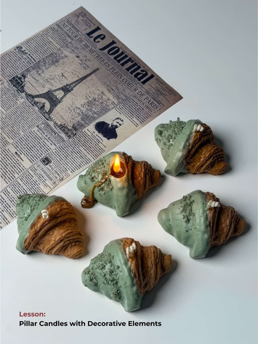Pillar candles with decorative croissant elements