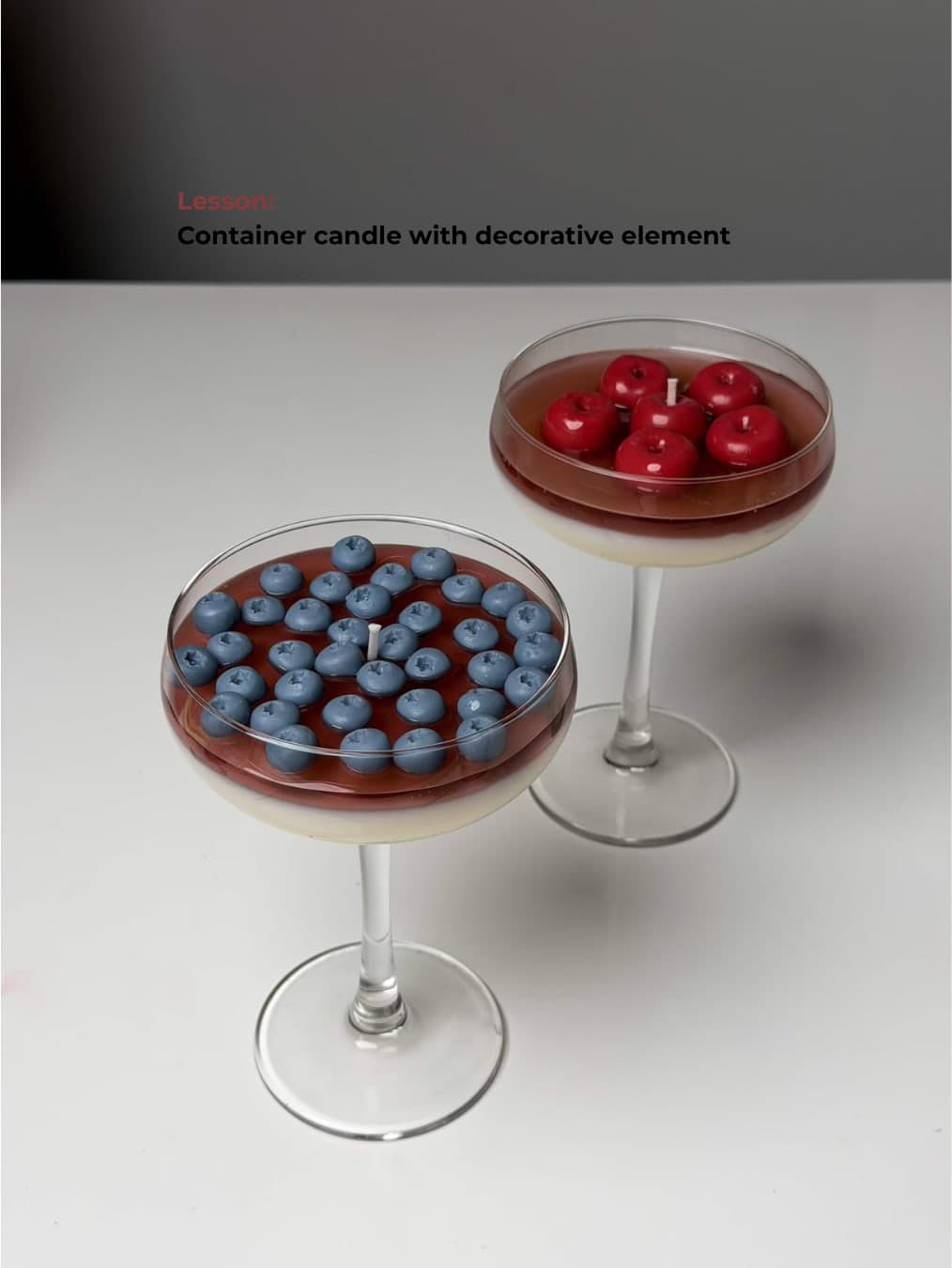 Container candles decorated with berries